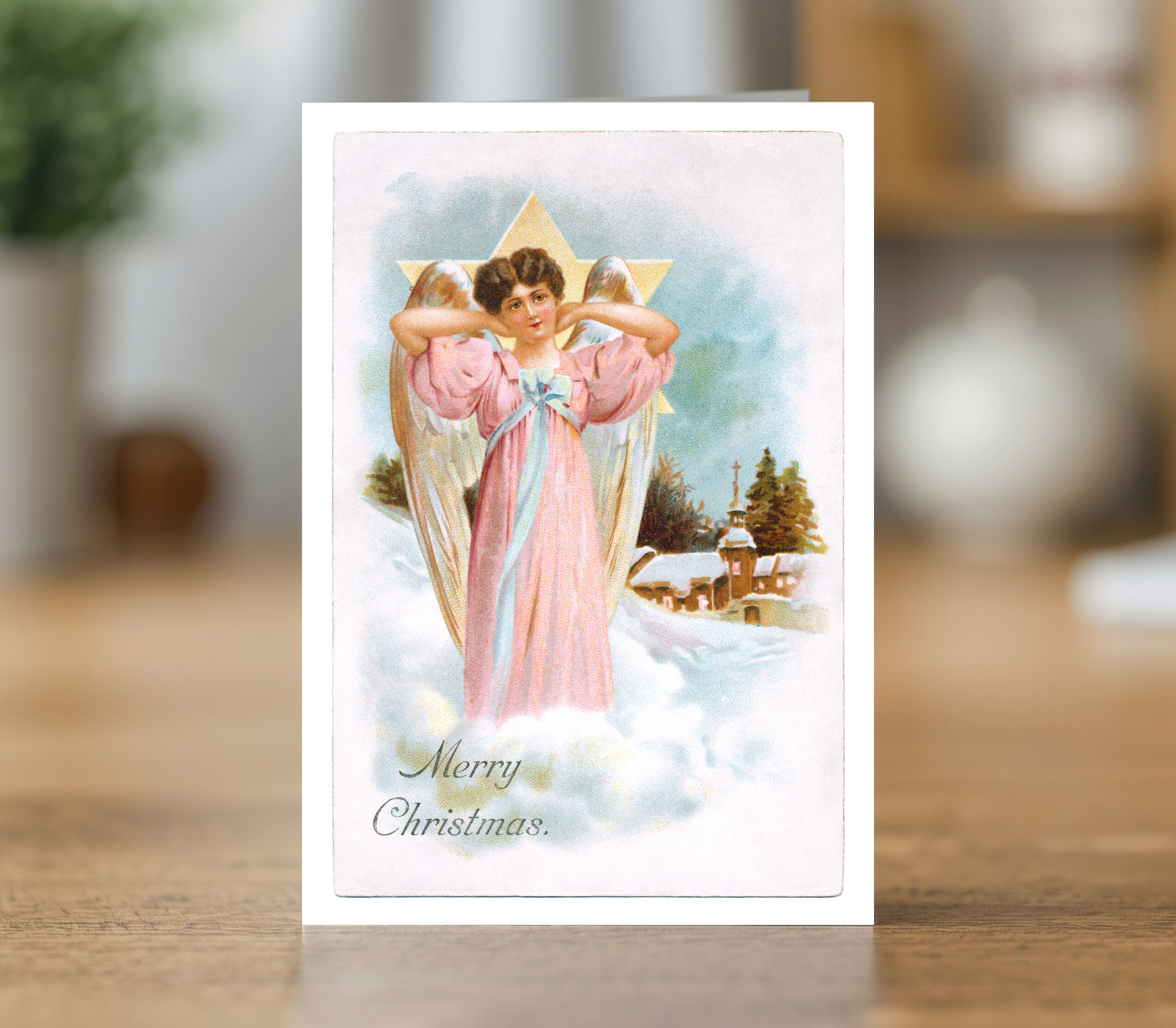 Greetings card reproducing a Merry Christmas angel and Christmas scene design - new reproduction